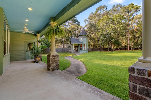 view of yard featuring ceiling fan