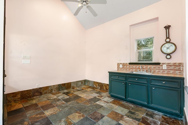 clothes washing area with ceiling fan and sink