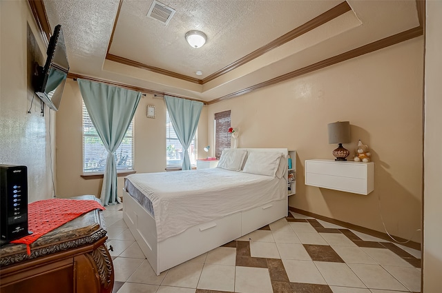 bedroom featuring ornamental molding, a raised ceiling, a textured ceiling, and light tile patterned floors