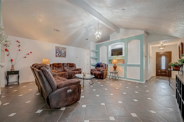 living room featuring lofted ceiling with beams, a textured ceiling, and a notable chandelier