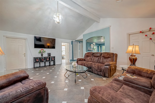 living room featuring a notable chandelier and lofted ceiling with beams