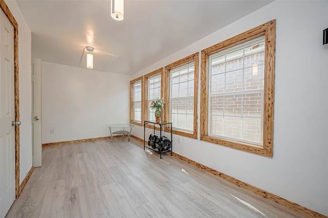 empty room with a healthy amount of sunlight and light wood-type flooring