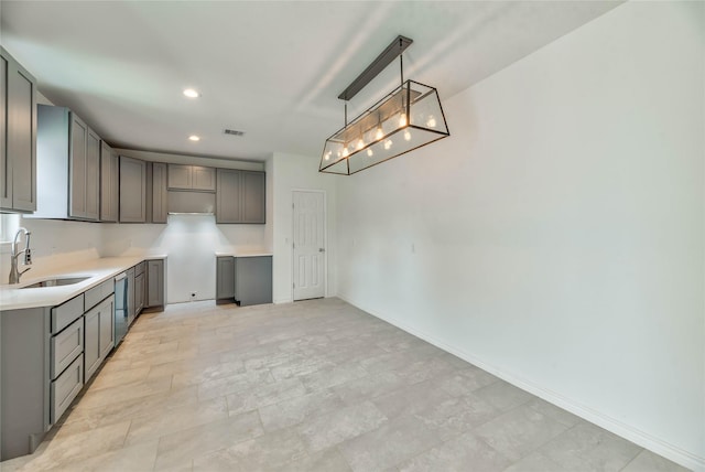 448 Brahman, Onalaska, TX 77360 - kitchen featuring gray cabinetry, recessed lighting, decorative light fixtures, and light countertops