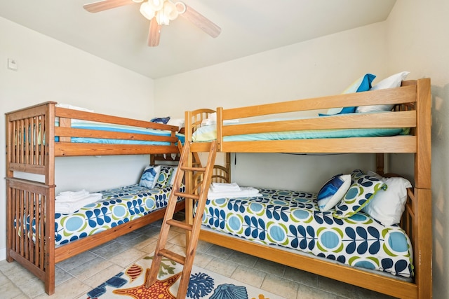 tiled bedroom with ceiling fan