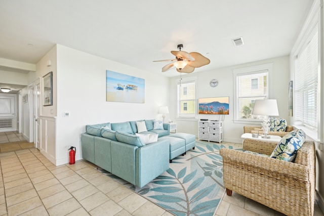 living room with light tile patterned flooring and ceiling fan