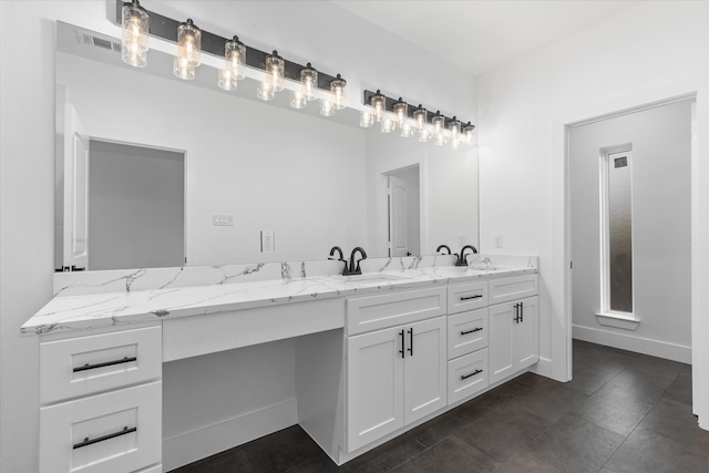 bathroom featuring tile patterned floors and vanity