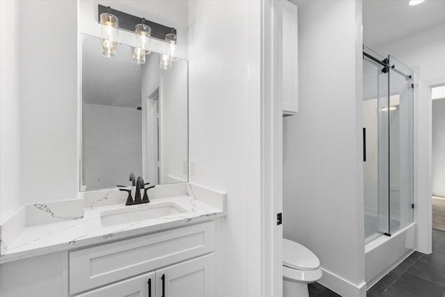 full bathroom with shower / bath combination with glass door, vanity, tile patterned flooring, and toilet