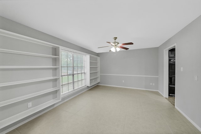 spare room featuring ceiling fan