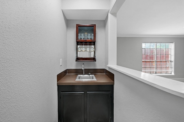 interior space with ornamental molding and vanity