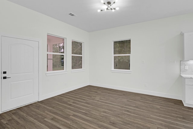 spare room featuring dark hardwood / wood-style floors