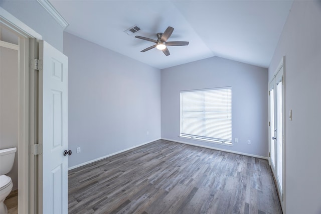 unfurnished room featuring vaulted ceiling, dark wood-type flooring, and ceiling fan