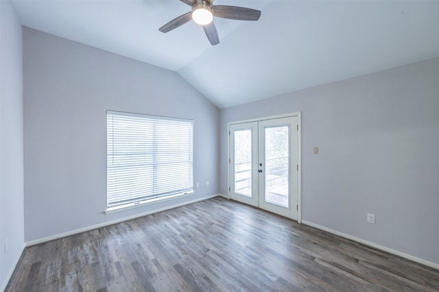 spare room featuring lofted ceiling, ceiling fan, french doors, and dark hardwood / wood-style flooring