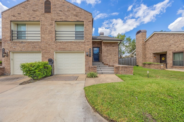 view of front of home featuring a garage and a front lawn