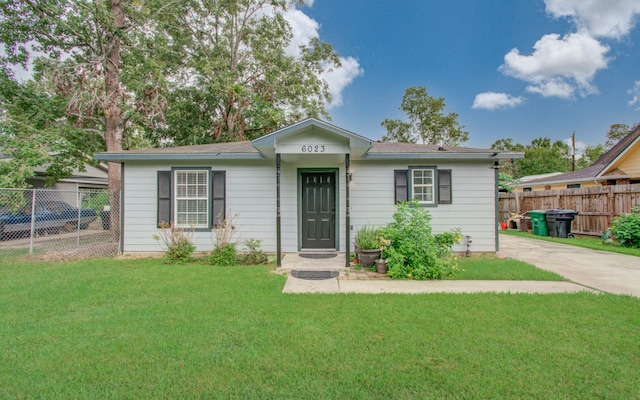 ranch-style house with a front lawn