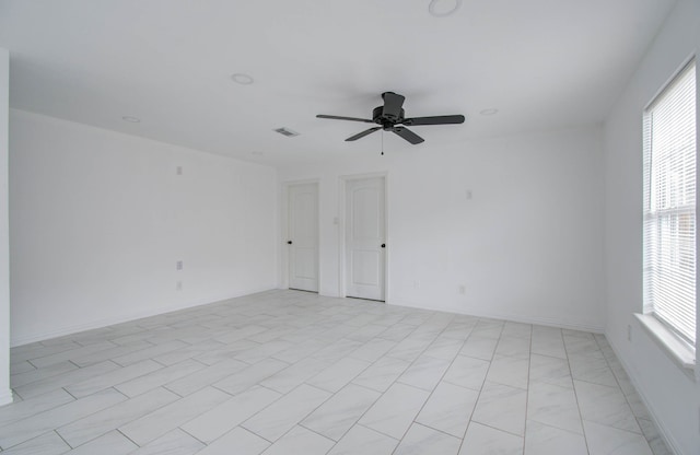 unfurnished room featuring ceiling fan