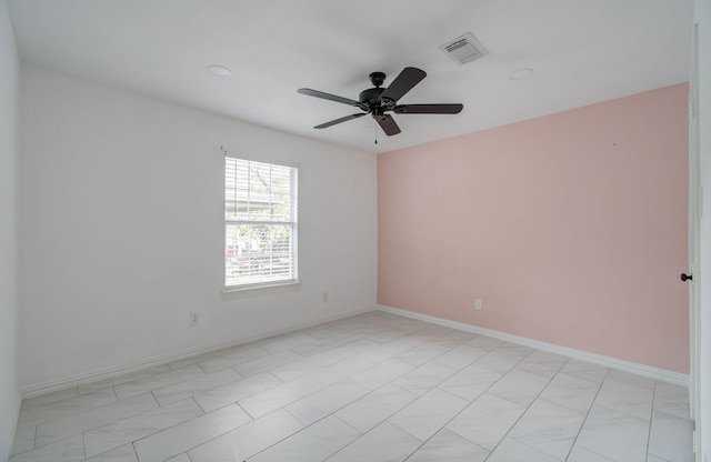 unfurnished room featuring ceiling fan