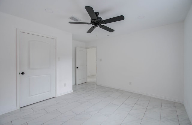 unfurnished bedroom featuring ceiling fan