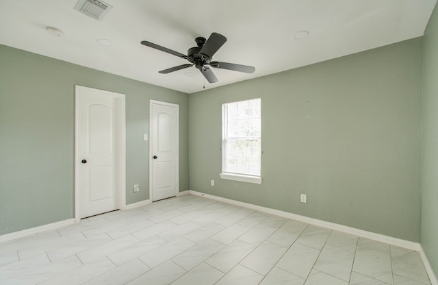 unfurnished bedroom featuring ceiling fan