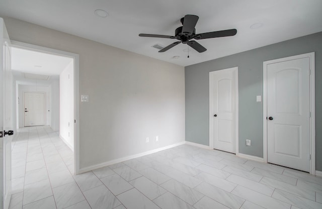 unfurnished bedroom featuring ceiling fan and light tile patterned flooring