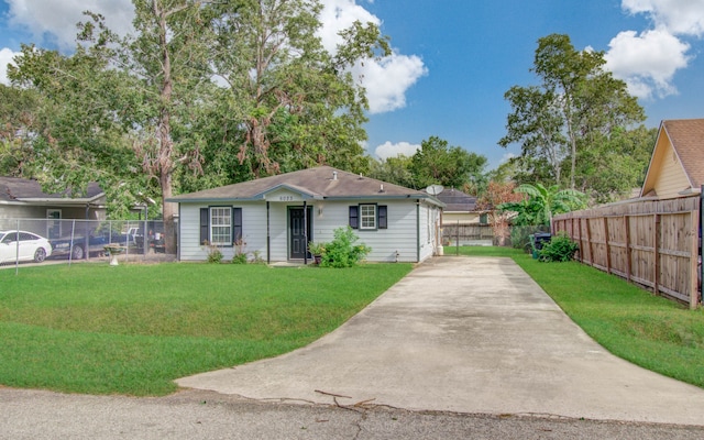 ranch-style home with a front lawn