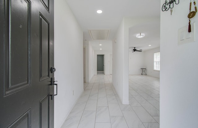 foyer featuring ceiling fan