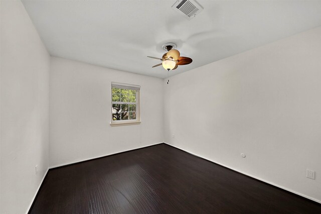 empty room with ceiling fan and hardwood / wood-style flooring