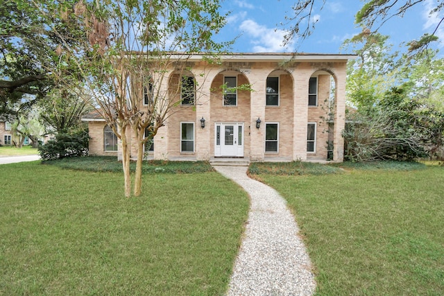 italianate-style house with a front yard