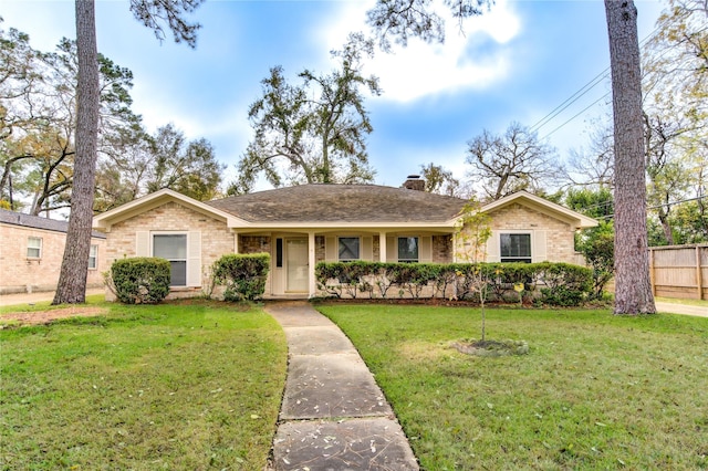 ranch-style home with a front lawn