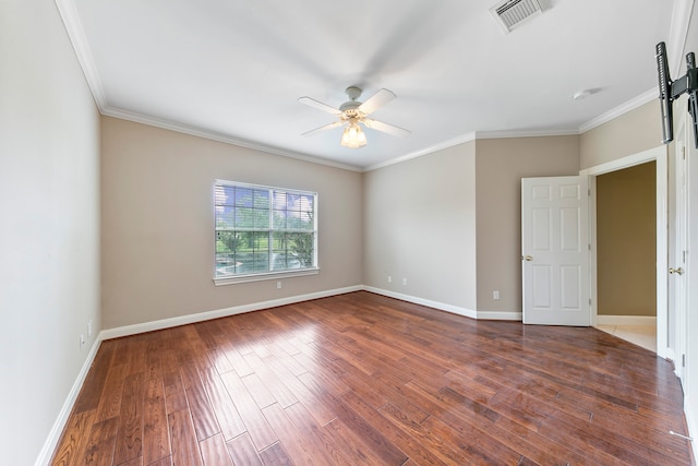 spare room with ornamental molding, dark hardwood / wood-style flooring, and ceiling fan