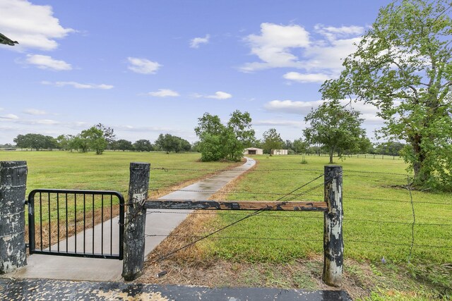 exterior space featuring a yard and a rural view