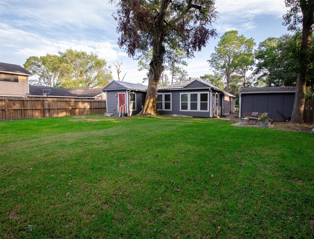 2620 W Shane St, Alvin, TX 77511 - back of house featuring a patio area
