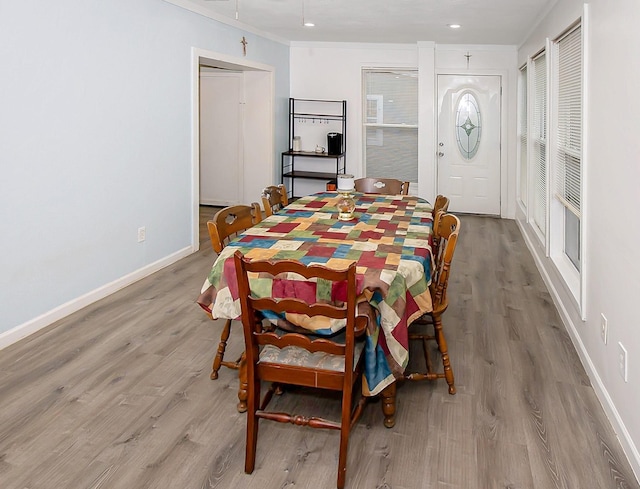 2620 W Shane St, Alvin, TX 77511 - dining room with wood finished floors, baseboards, ornamental molding, and recessed lighting