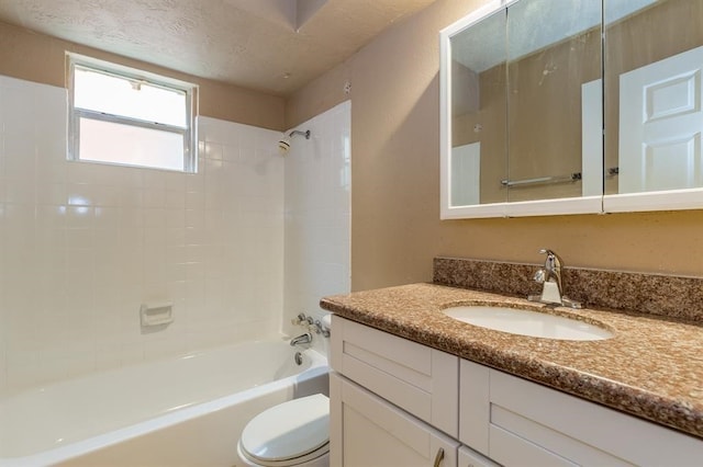 full bathroom with tiled shower / bath combo, vanity, and toilet