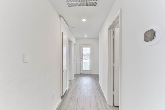 corridor featuring light hardwood / wood-style flooring