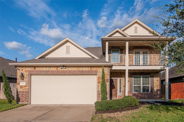 view of front of home featuring a balcony and a garage