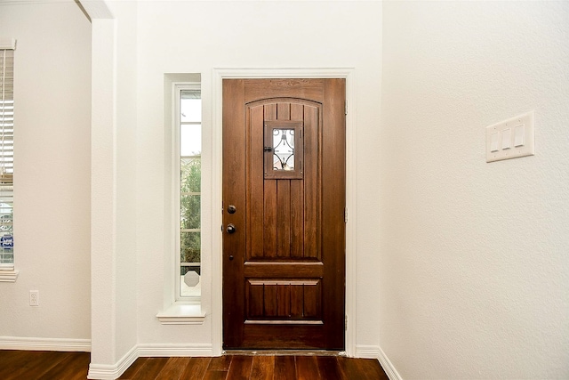 entrance foyer with dark hardwood / wood-style floors