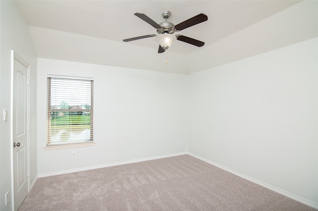 empty room with light colored carpet and ceiling fan