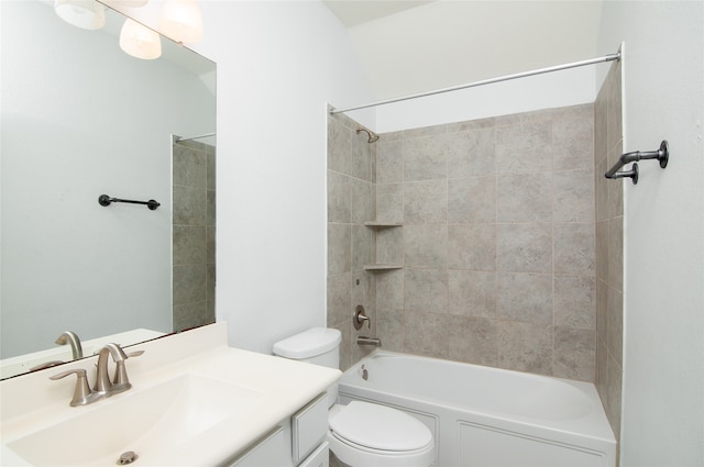 full bathroom featuring vanity, toilet, and tiled shower / bath