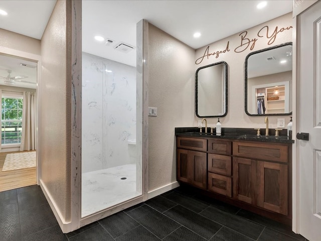 bathroom featuring a shower, vanity, ceiling fan, and hardwood / wood-style flooring