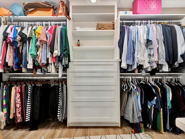 spacious closet featuring light hardwood / wood-style flooring