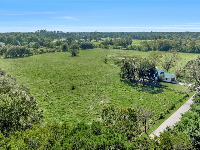 birds eye view of property featuring a rural view