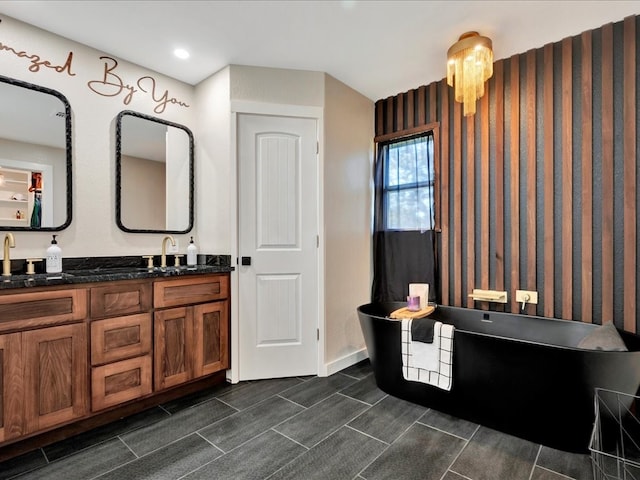 bathroom with vanity and a bathtub