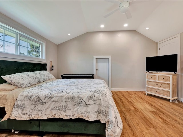 bedroom with light wood-type flooring, lofted ceiling, and ceiling fan