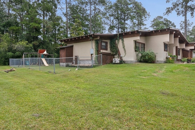 exterior space featuring a playground and a lawn