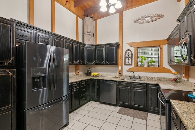 kitchen featuring beamed ceiling, appliances with stainless steel finishes, sink, a high ceiling, and light tile patterned flooring