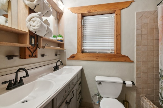 bathroom with a shower with curtain, toilet, and vanity