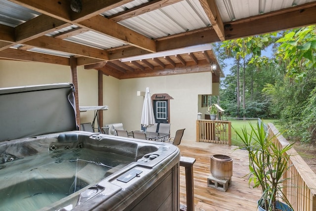 wooden terrace featuring a hot tub