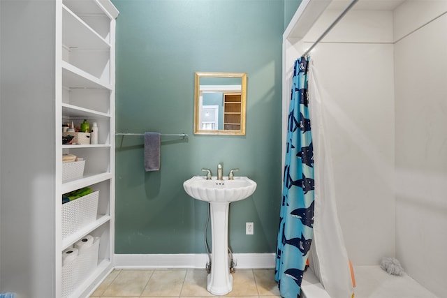 bathroom featuring walk in shower and tile patterned floors