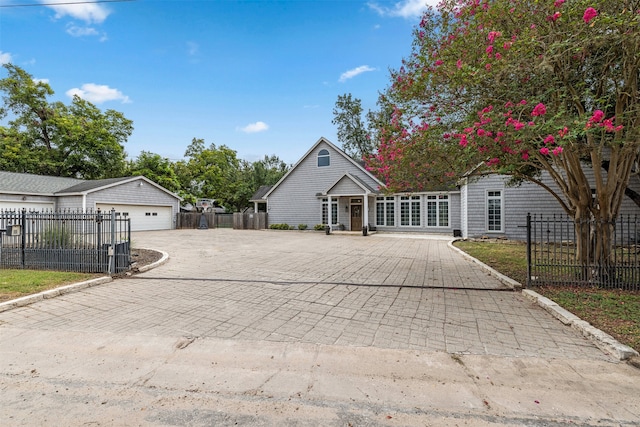 exterior space with a garage and an outdoor structure