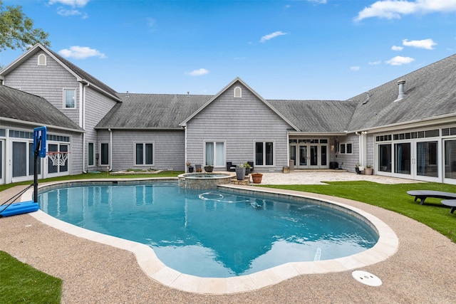 back of house with french doors, a lawn, and a patio